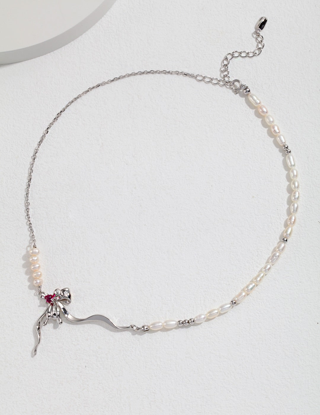 Silver necklace with pearls and purple zircon spider pendant