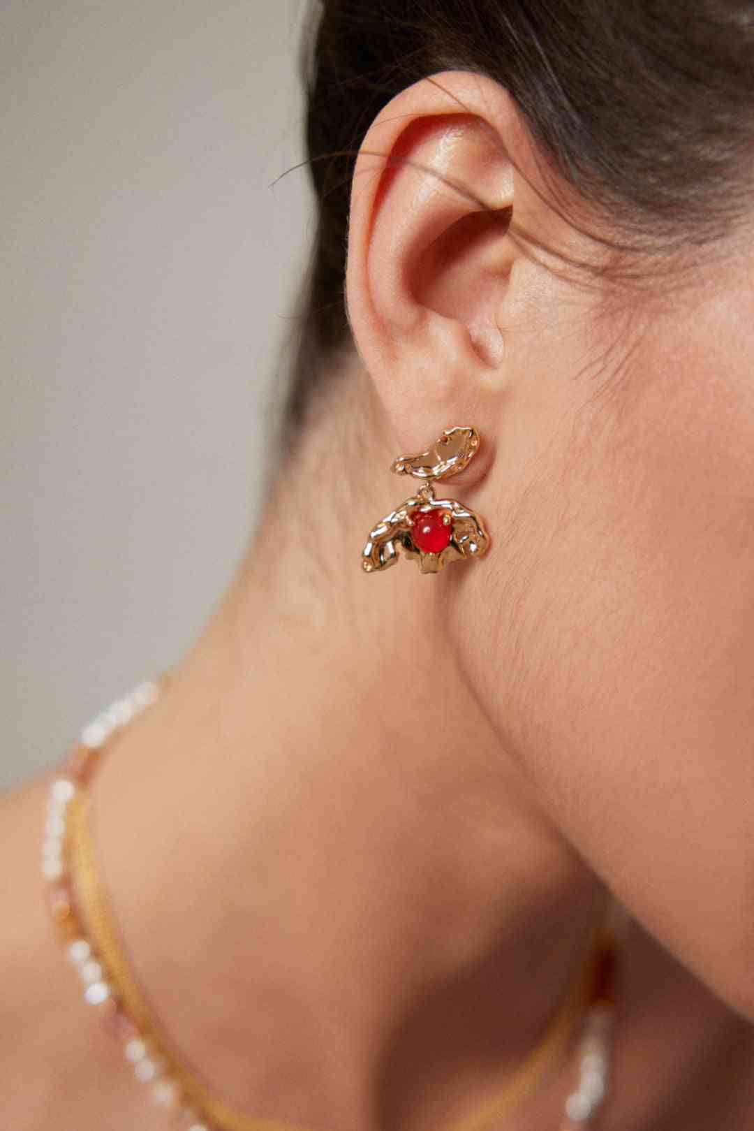 Red Agate Earrings on model's ear