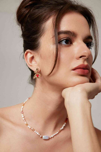 Model wearing Red Agate Earrings and necklace