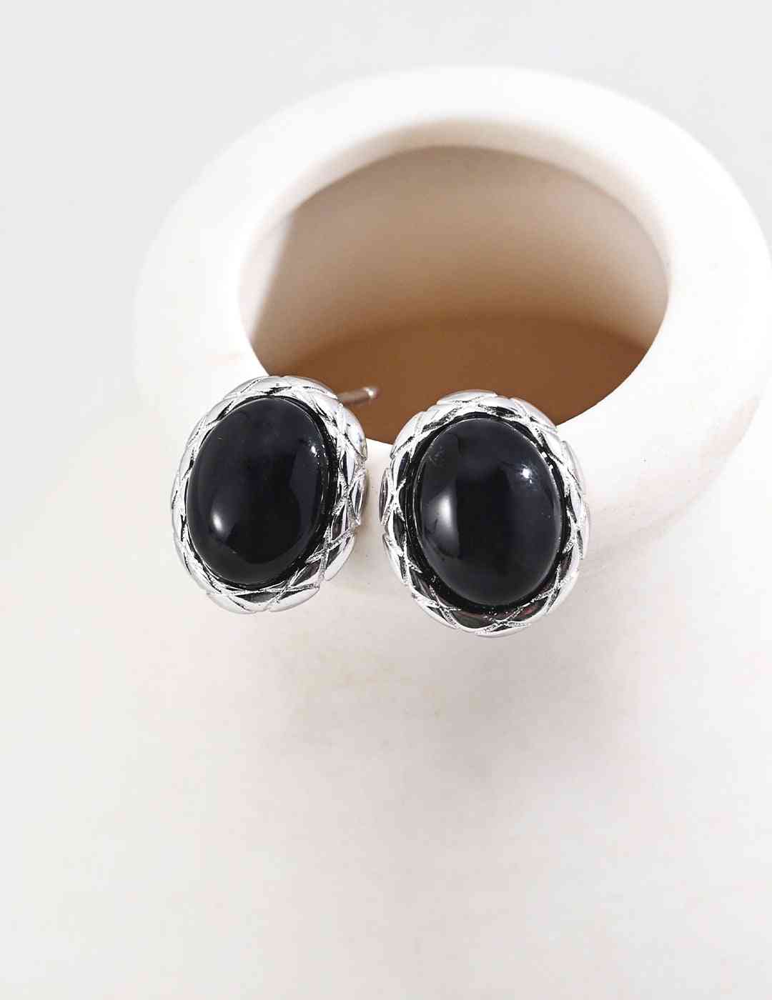 Silver Noir Elegance black agate stud earrings on display