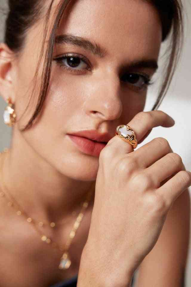 Model wearing Celestial Seashell ring and necklace