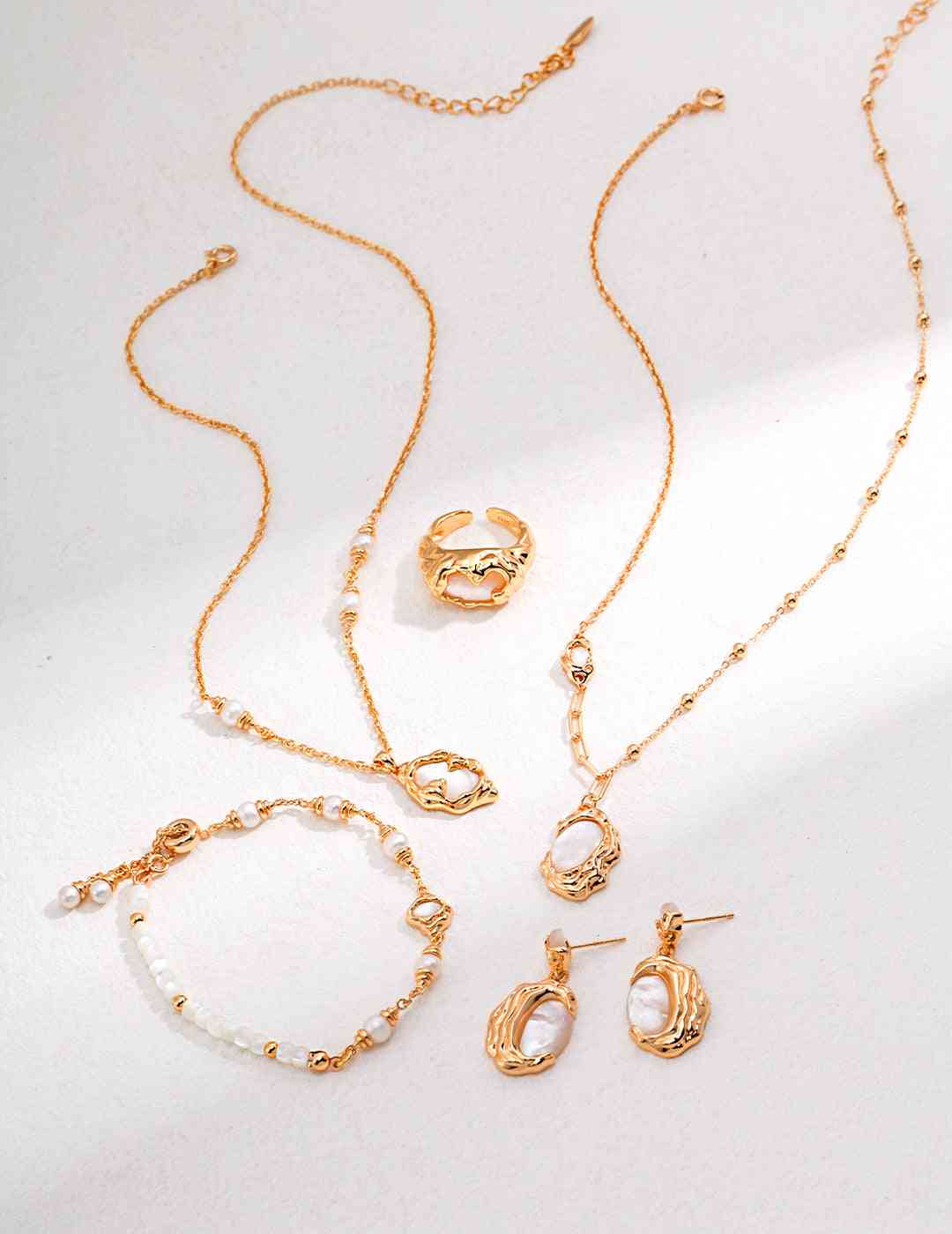 Celestial Seashell jewelry set with necklaces, ring, and earrings