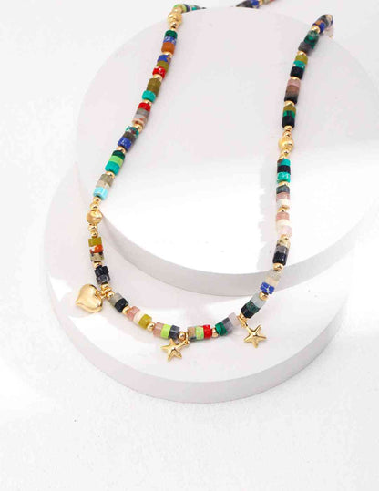 a multicolored crystal beaded necklace with a star charm