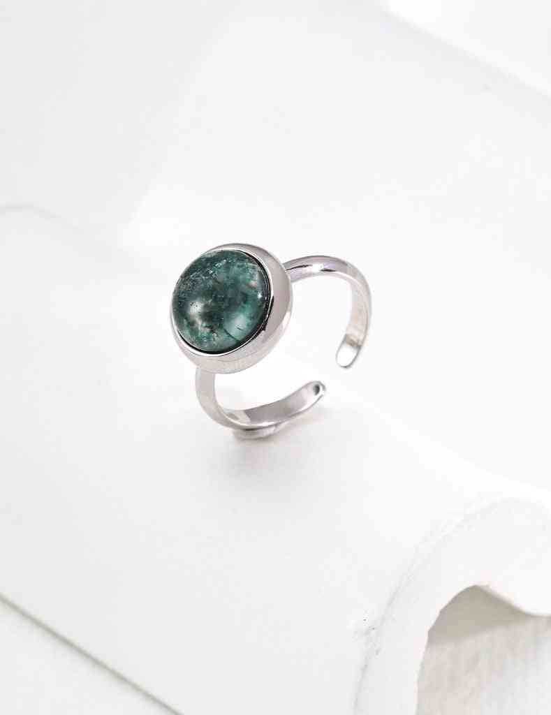 a silver ring with a green aquatic agate stone on it