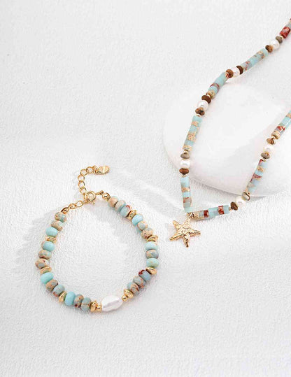 a bracelet with a starfish charm and a beaded bracelet