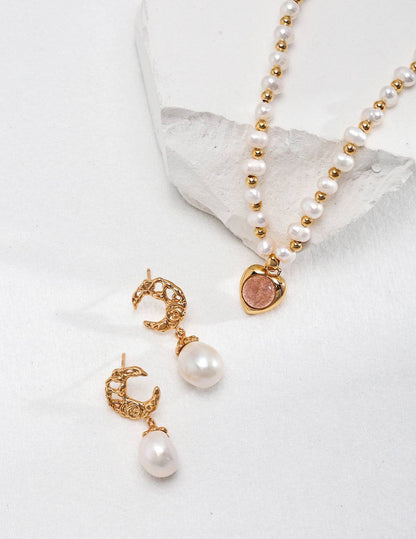 a necklace and earring set with pearls