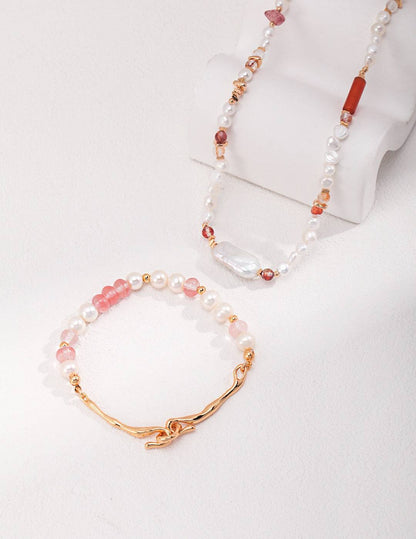 a pair of bracelets with pearls and a gold clasp