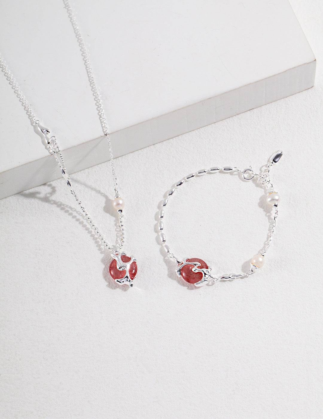 a couple of bracelets and a necklace on a table