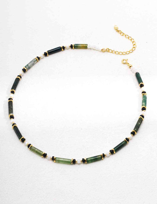 a necklace with green aquatic agate beads and a gold chain